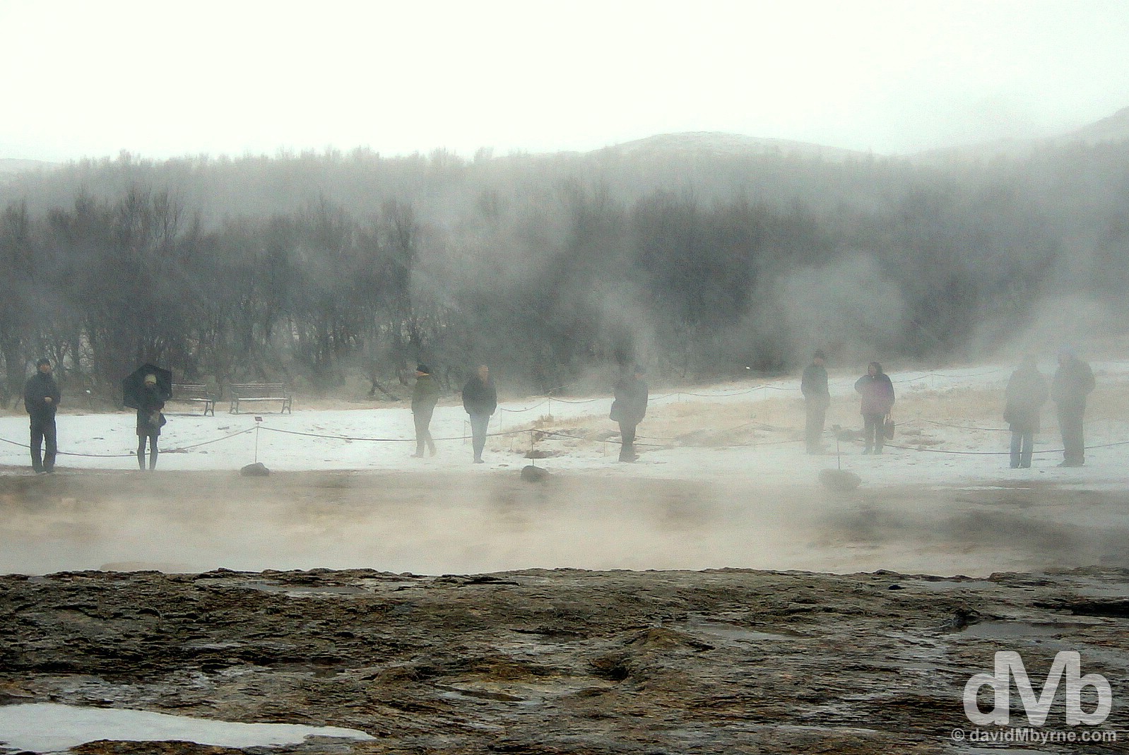 Standing by the Strokkur Geyser waiting for it to erupt (which it does so every 8-10 minutes) in the Haukadalur geothermal area, Iceland. December 3, 2012.