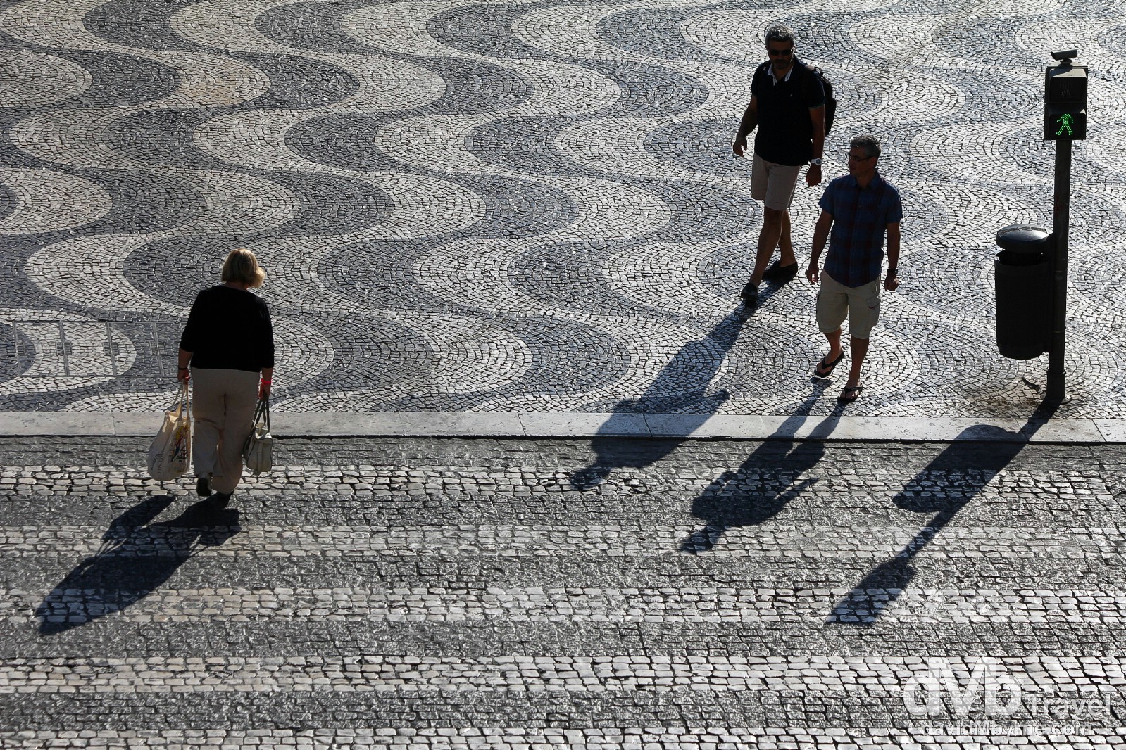 Early morning shadows crossing Praça de D. Pedro IV (Rossio Square), Lisbon, Portugal. August 25th 2013.