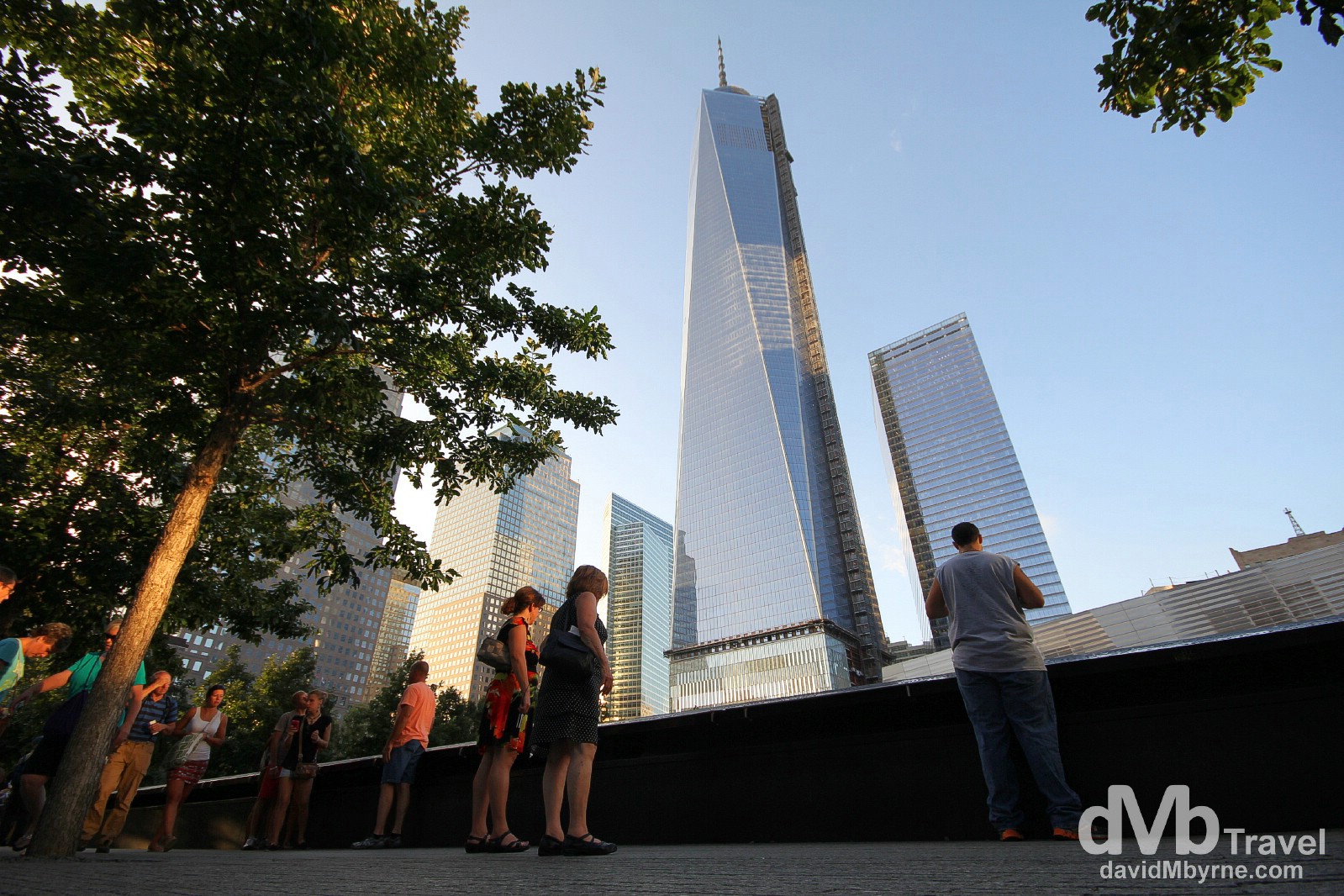 Towers of the rebuilt World Trade Center towering over the The 9/11 Memorial, lower Manhattan, New York City, USA. July 14th 2013.