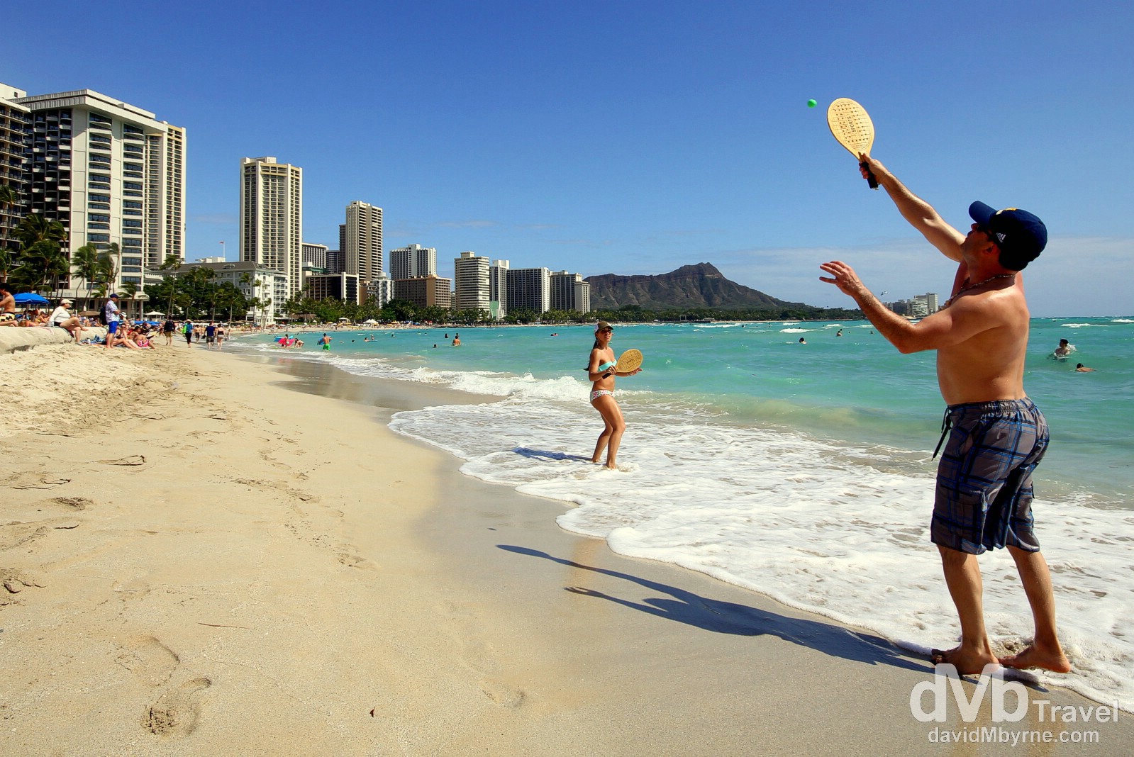 Paddle ball on Waikiki Beach with the Waikiki landmark of Diamond Head in the distance. Oahu, Hawaii, USA. March 9th 2013. 