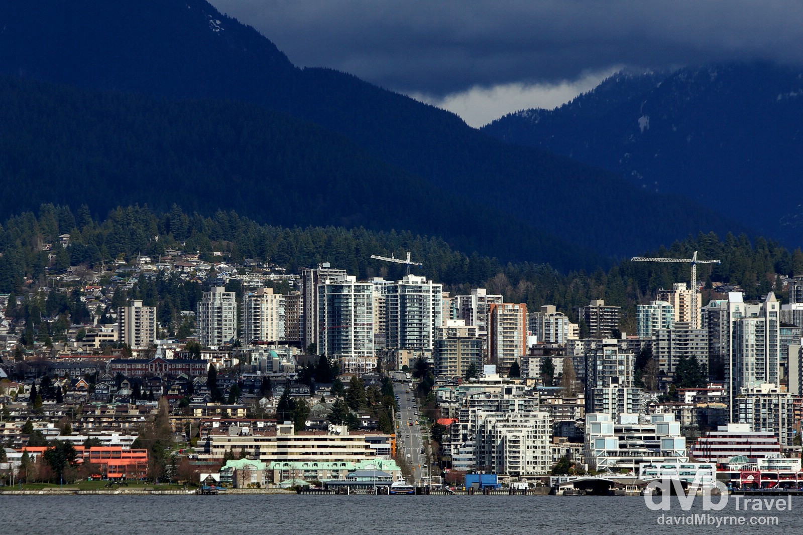 A picture of North Vancouver taken from the waters edge across Burrard Inlet in downtown Vancouver, British Columbia, Canada. March 20th 2013.