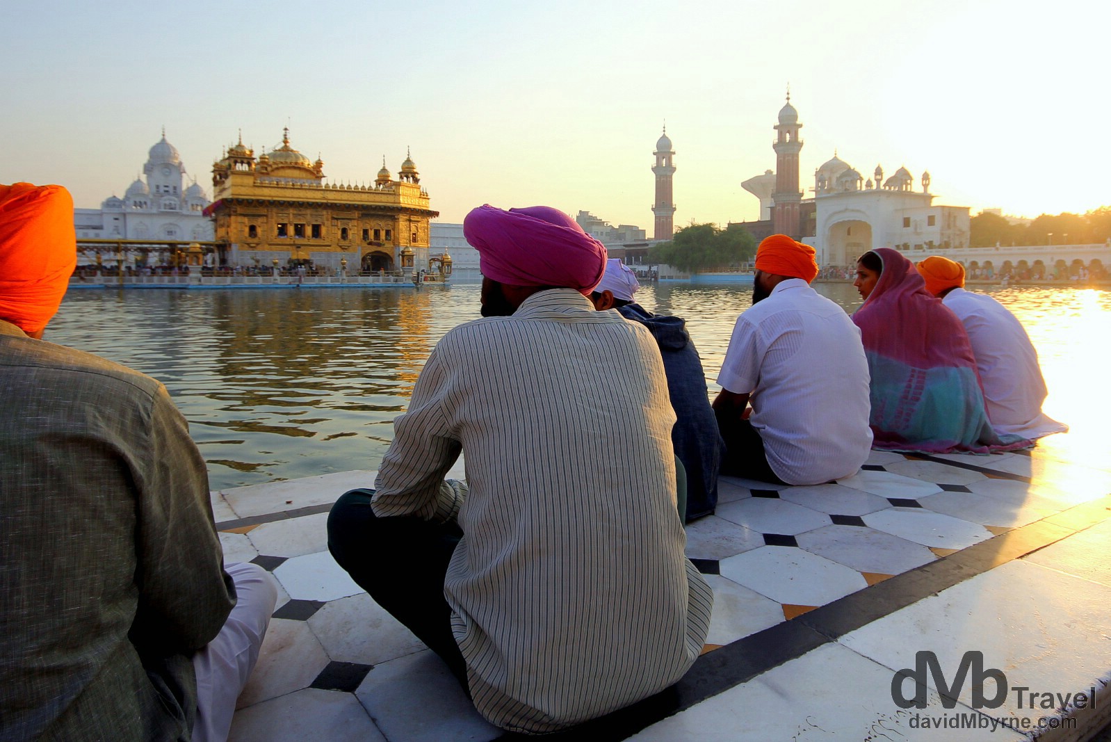 Sitting by the Amrit Sarovar (Pool of Nectar) at sunrise at the Golden Temple, Amritsar, India. October 9th 2012.