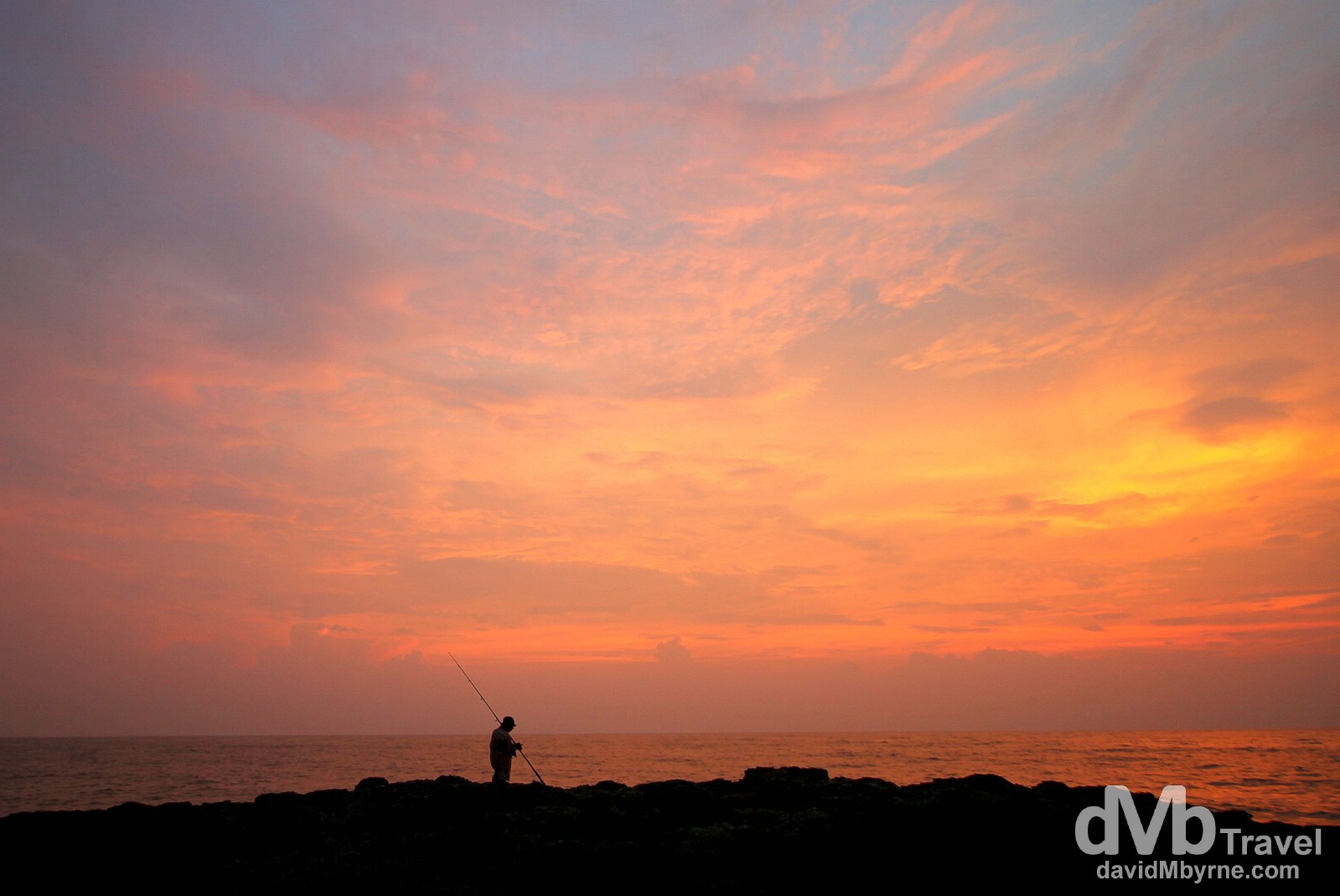 Fishing at sunset at Anjuna Beach in Goa, India. September 29th 2012.