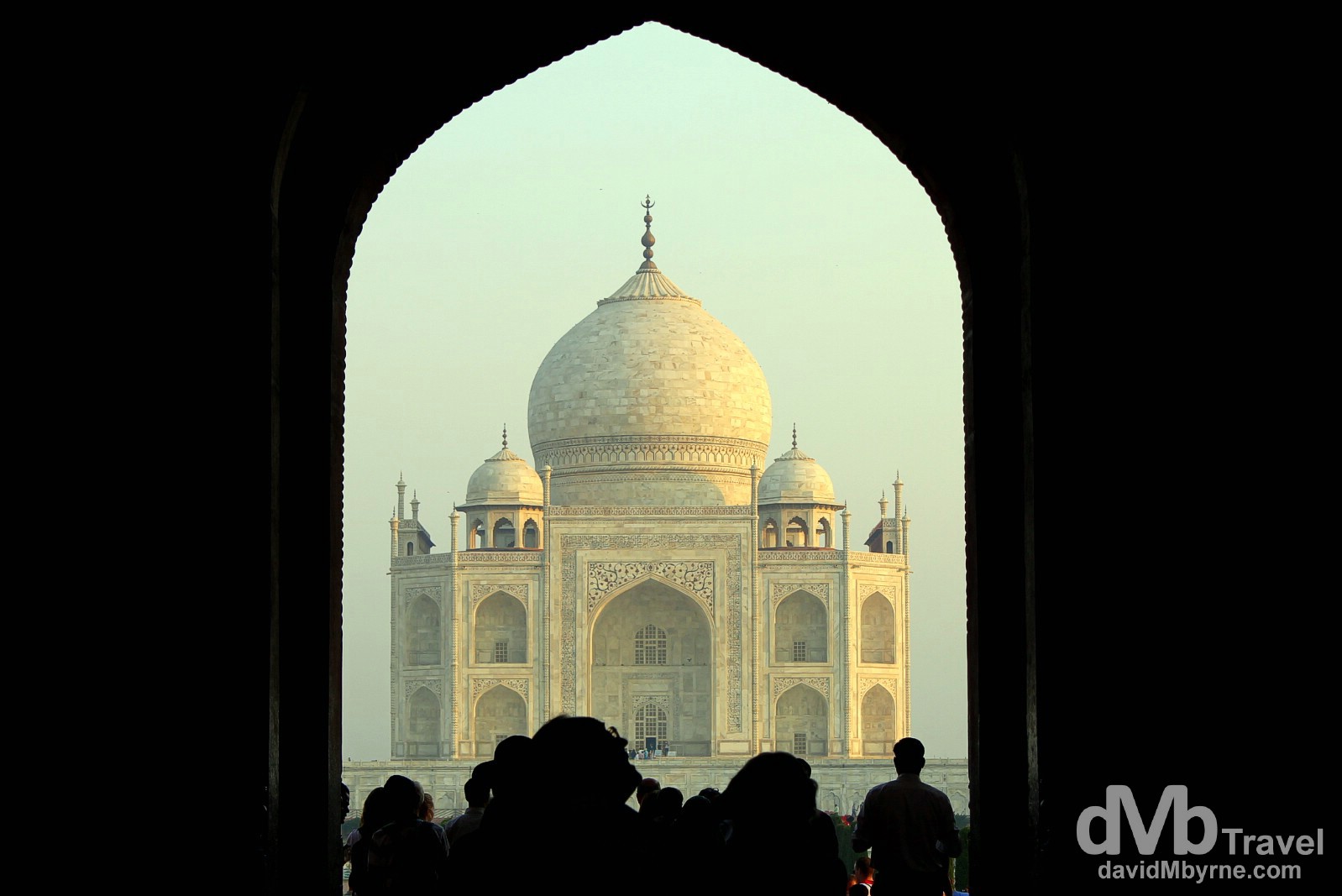 The TaJ Mahal at sunrise as seen from under the arch of the South Gate. Agra, Uttar Pradesh, India. October 11th 2012.