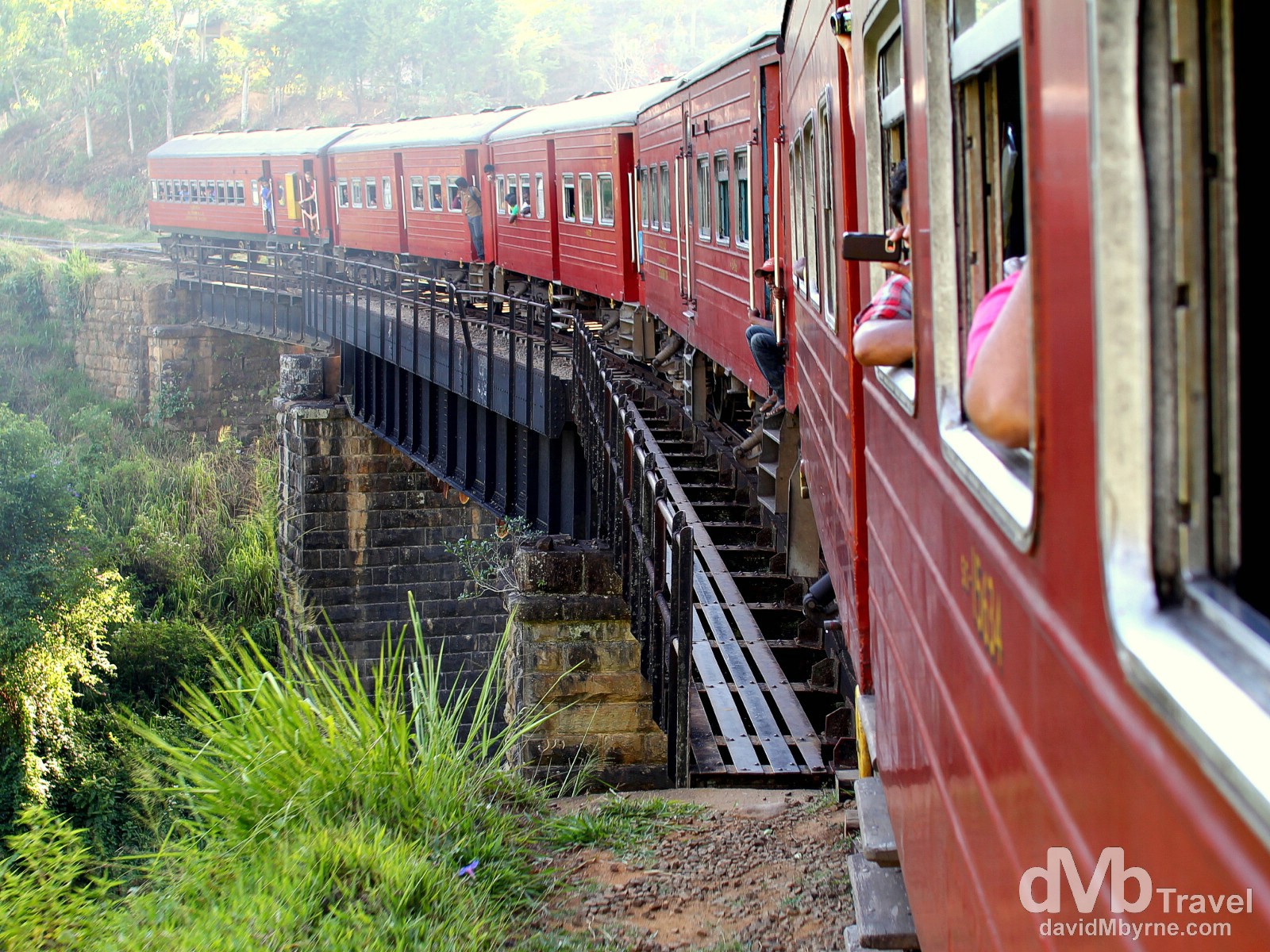 Sunrays over the rear of the Badulla to Colombo train as it crosses a bridge in central Sri Lanka. September 5th 2012.