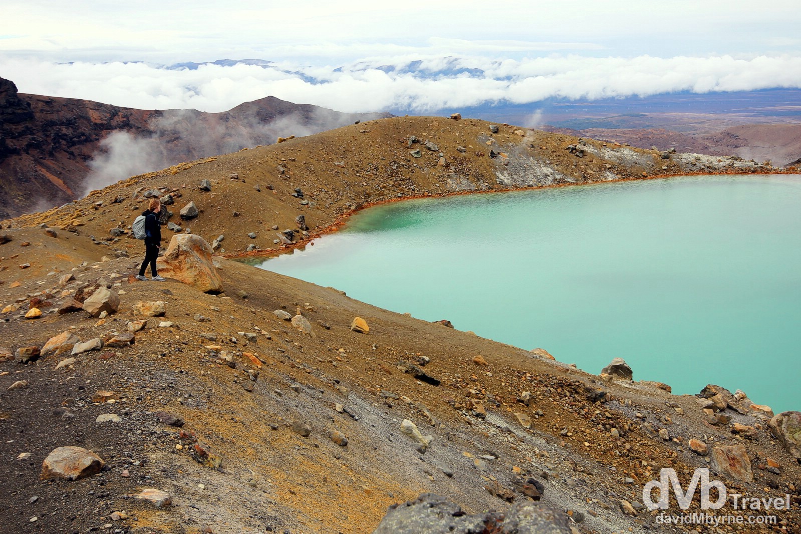 Standing by an emerald green volcanic lake in Tongariro National Park, North Island, New Zealand. May 9th 2012.