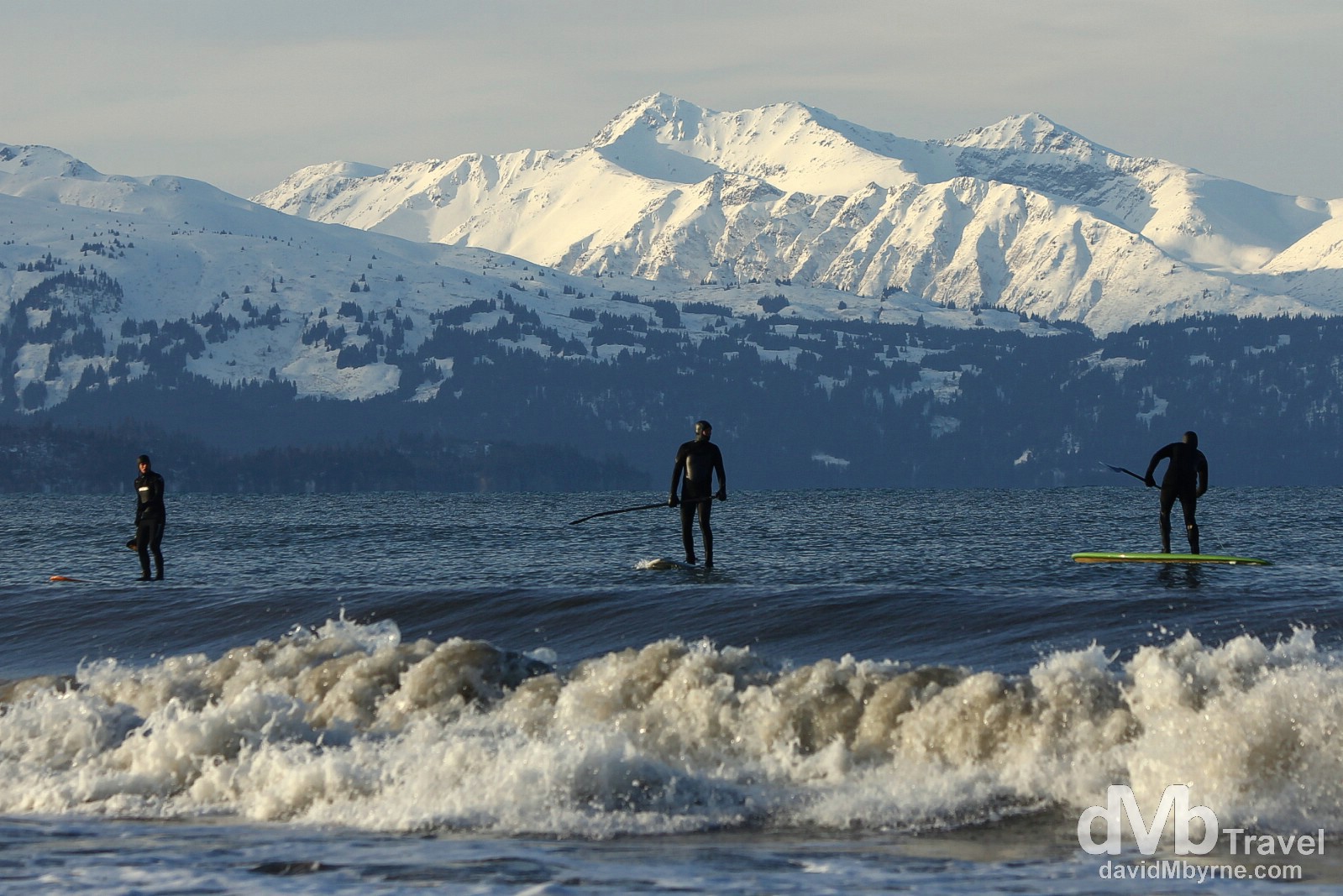 Paddle boarding off the Spit in Homer, Kenai Peninsula, Alaska, USA. March 18th 2103.  