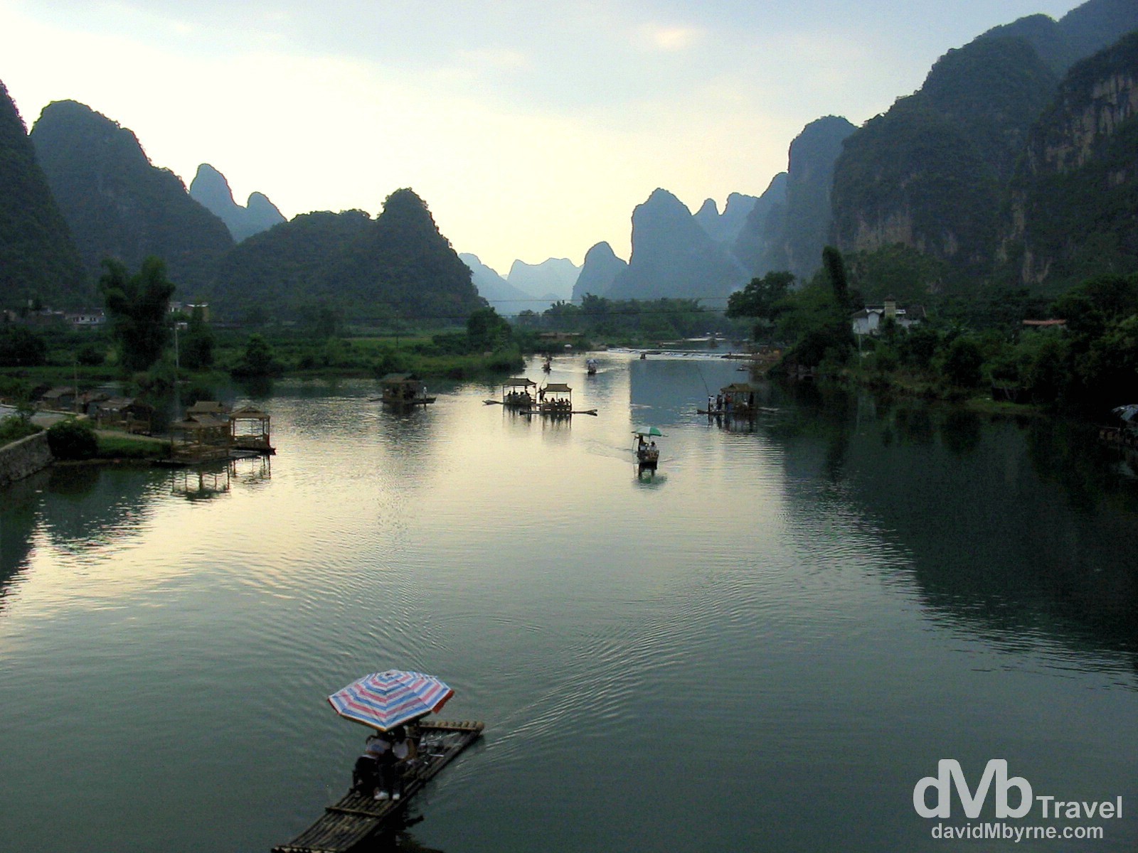 Getting punted near sunset on a section of the Li River outside Yangshuo, Guangxi Province, Southern China. September 11th, 2004.