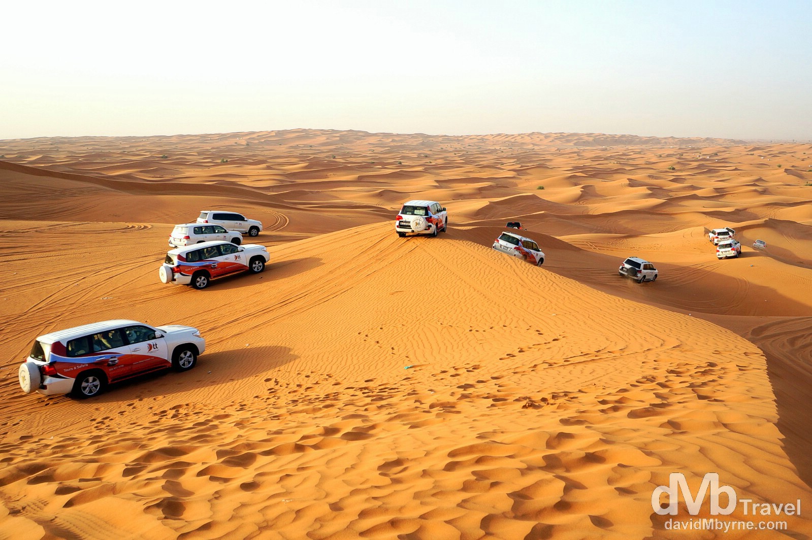 4x4 off-road dune bashing convoy in the expansive desert outside Dubai, UAE. April 17th, 2014.