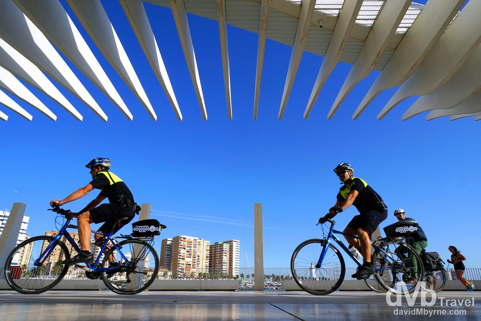 Malaga Police on the bicycle beat on Muelleuno, Puerto de Malaga, Andalusia, Spain. June 9th, 2014.