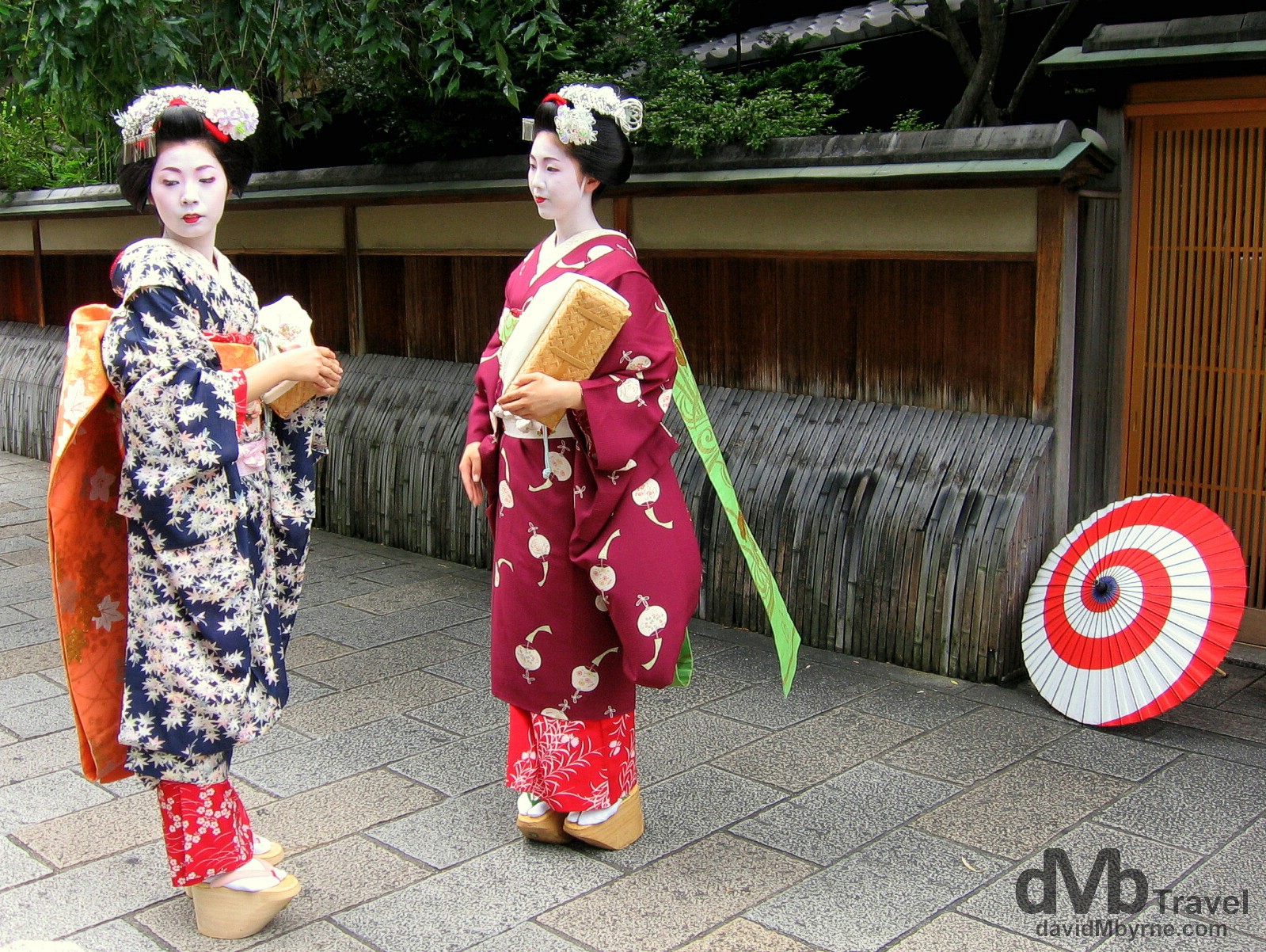 Maiko, trainee Geisha, on the streets of the Gion district of Kyoto, Honshu, Japan. July 18th, 2005.