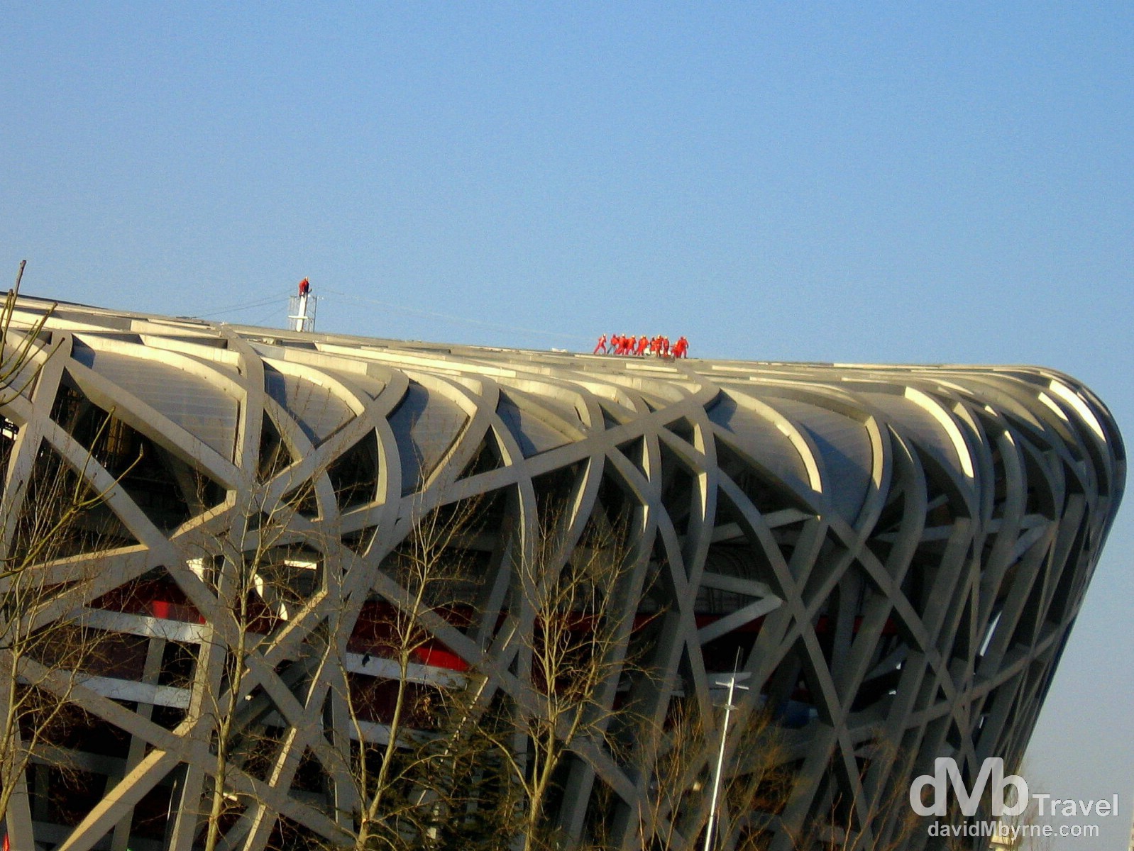 Workers on the roof of the Olympic Stadium, aka The Bird's Nest, in Beijing Olympic Park, Beijing, China. February 16th, 2008.