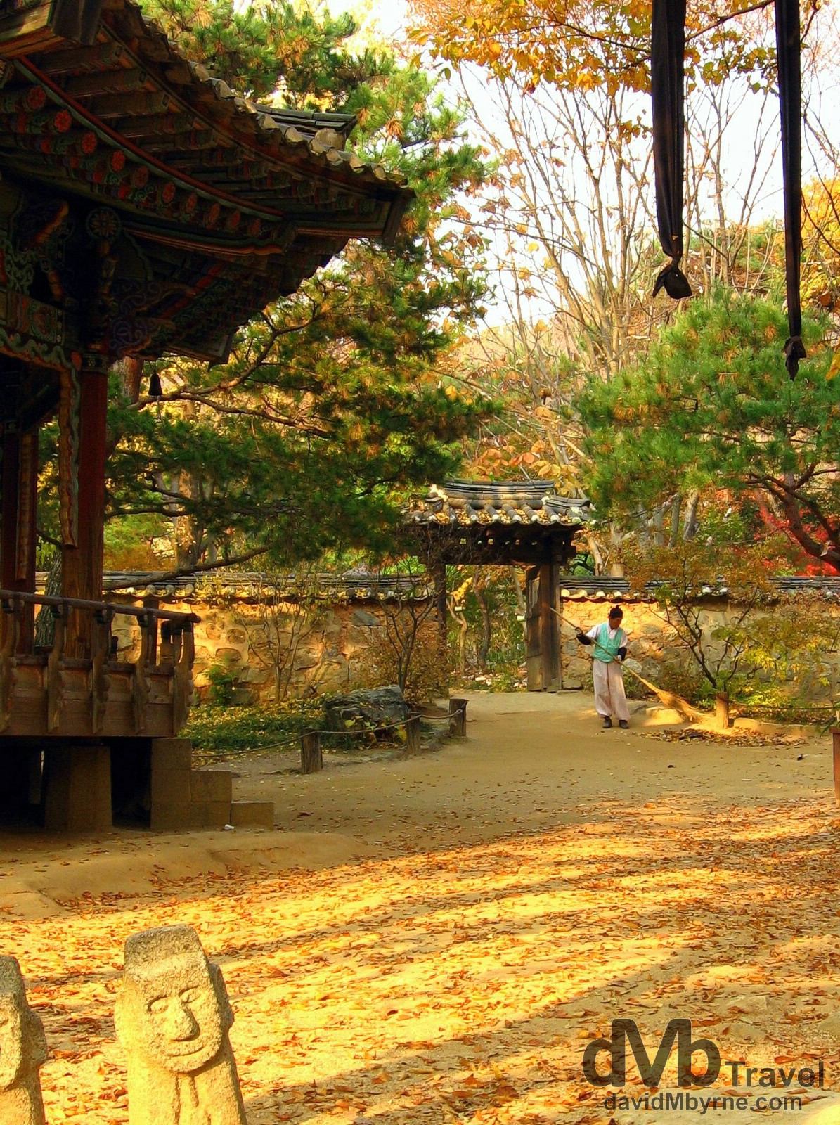 Sweeping up the leaves at the Folk Village in Yongin, South Korea. November 7th, 2007. 