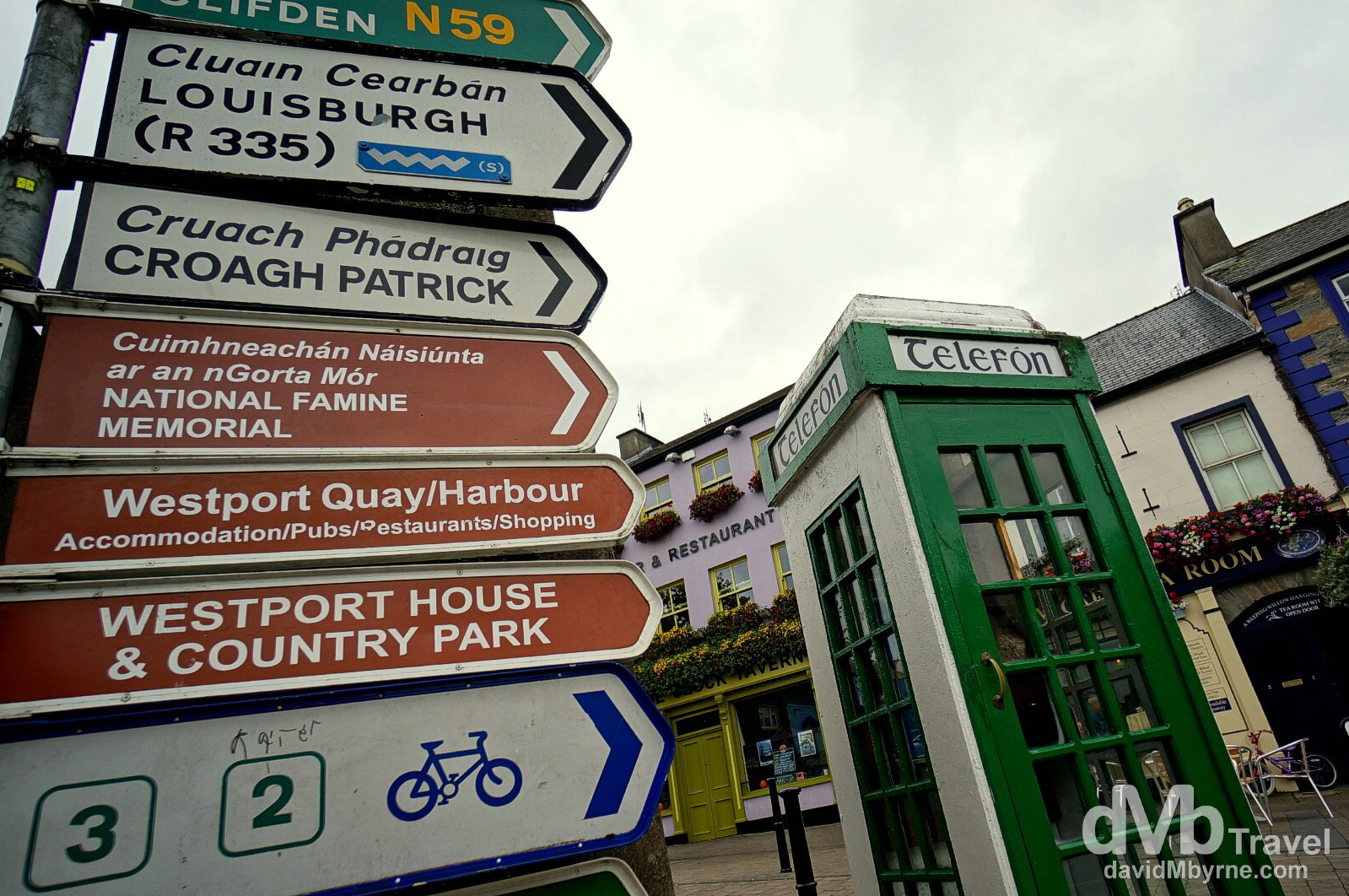 Street signs and an old school telephone box in Westport, Co. Mayo (map marker H), Ireland. August 26, 2014.