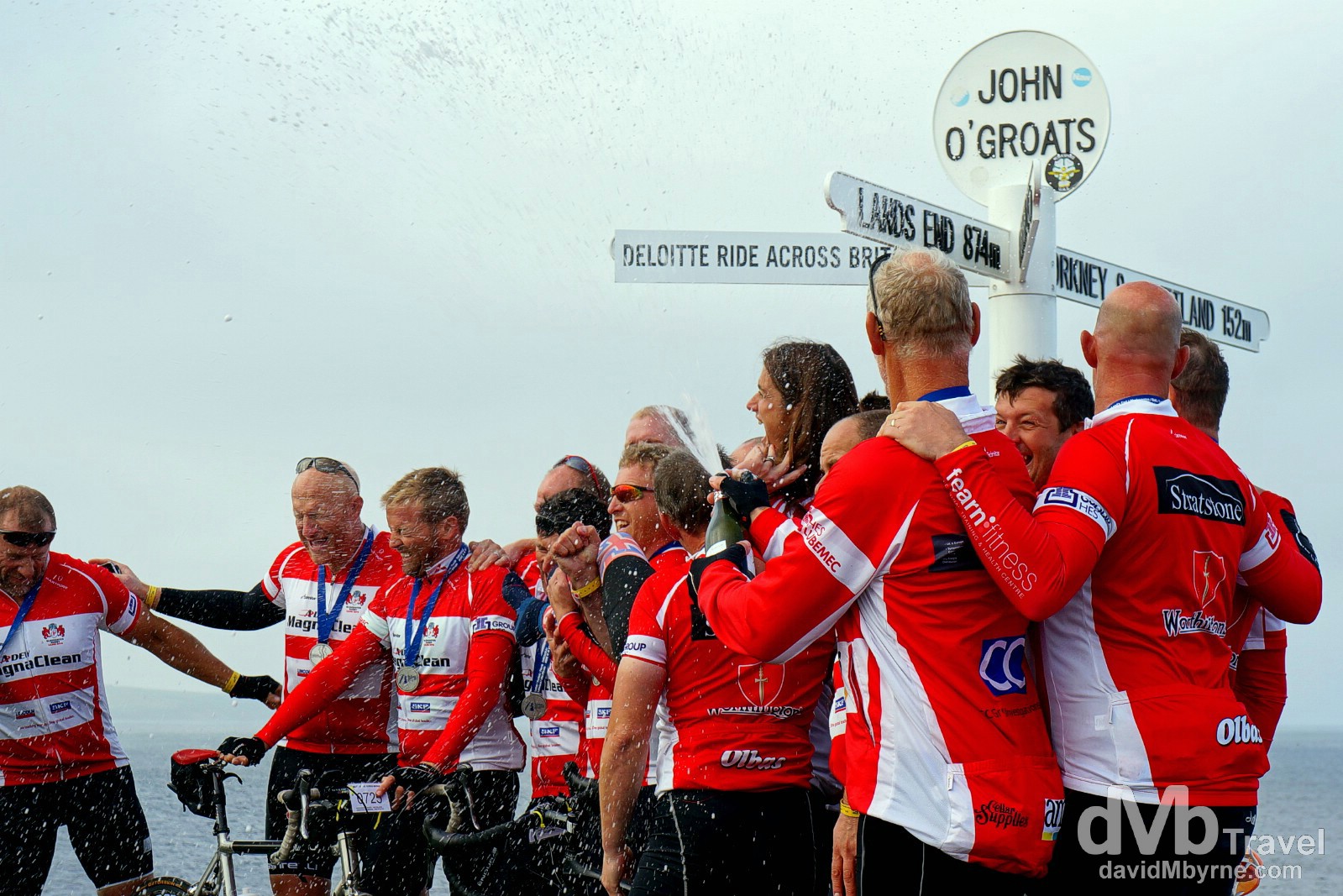 Deloitte Ride Across Britain 2014 participants celebrate completing the 9-day, 874 mile cycle from Land's End by the post at John O'Groats in Scotland. September 14, 2014.