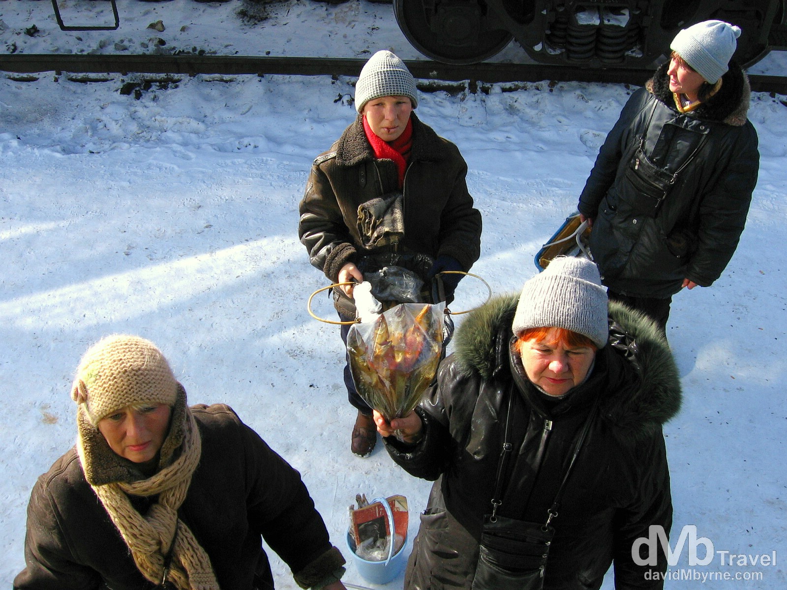 Babushkas on the platform of the Siberian town of Slyudyanka en route from Ulan Bator, Mongolia, to Irkutsk, Russia. February 17, 2006. 