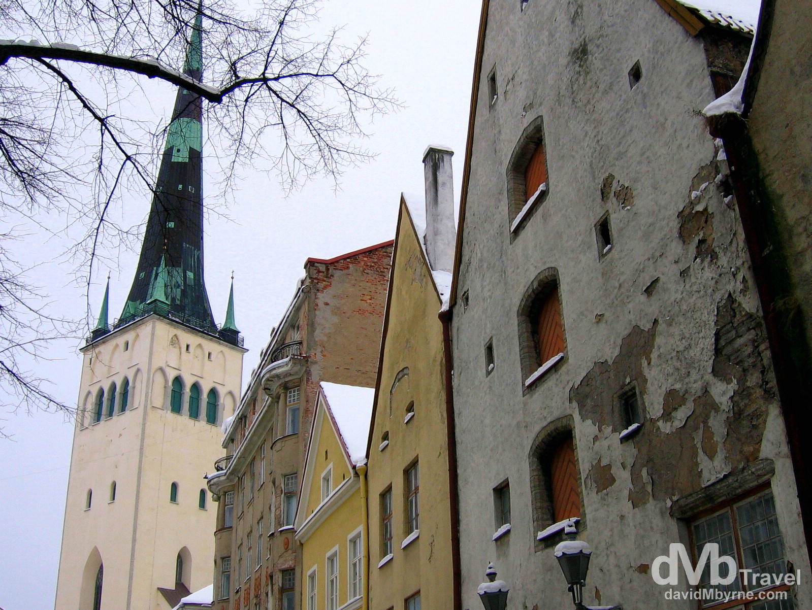 Buildings facades & the spire of the Oleviste Church in the Old Town of Tallinn, Estonia. March 2, 2006.