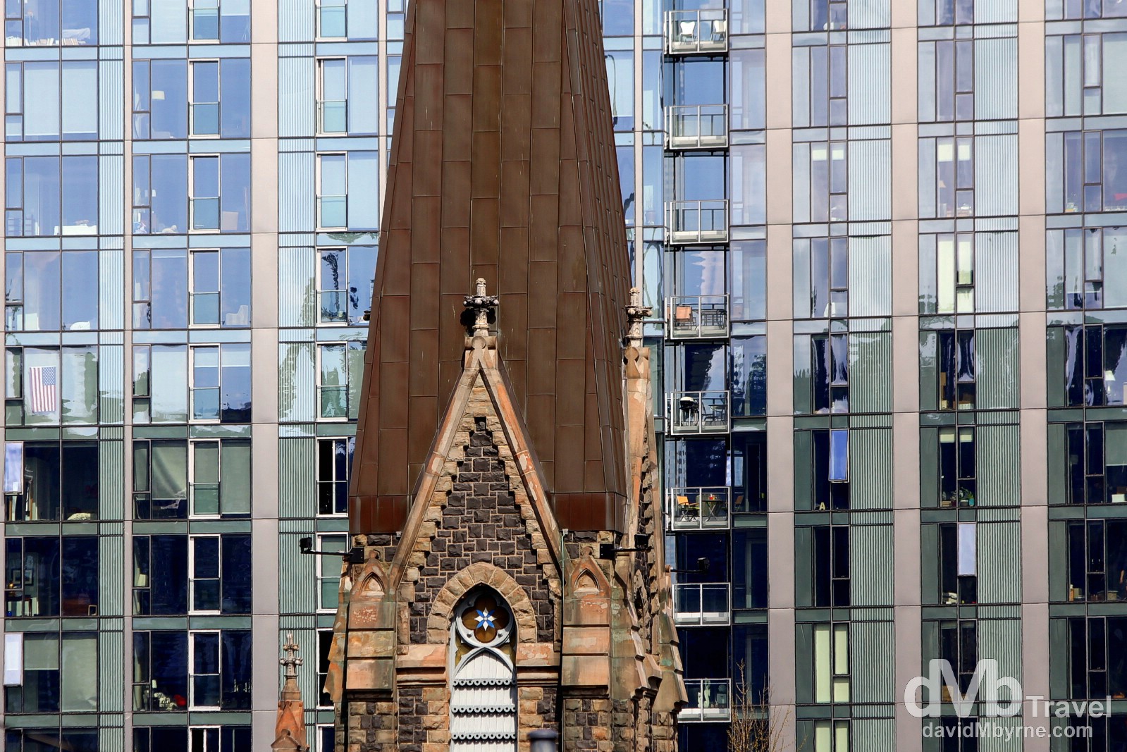 Old & new. A portion of the spire of the First Presbyterian Church set against an office & residential block in Portland, Oregon, USA. March 28, 2013. 