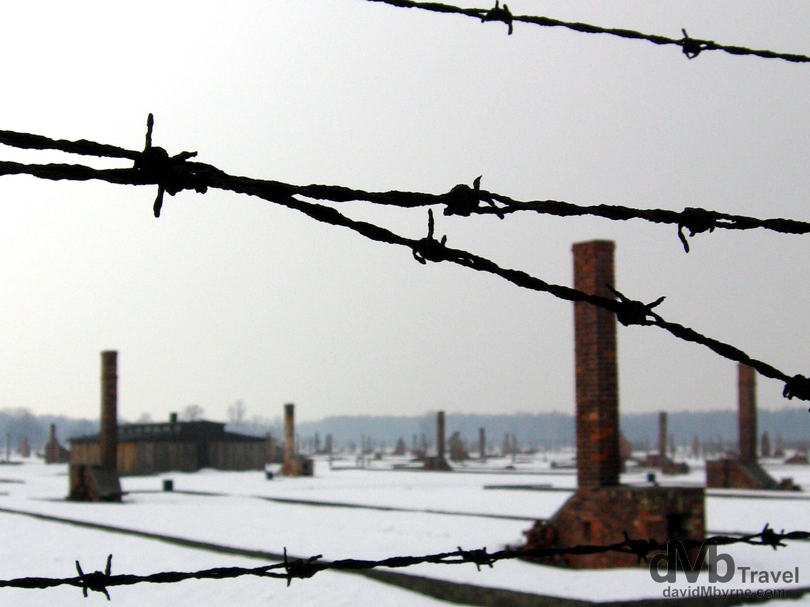 Remnants of the horrific past as seen through the fencing of the Birkenau Concentration Camp in Brzezinka, Poland. March 7, 2006,