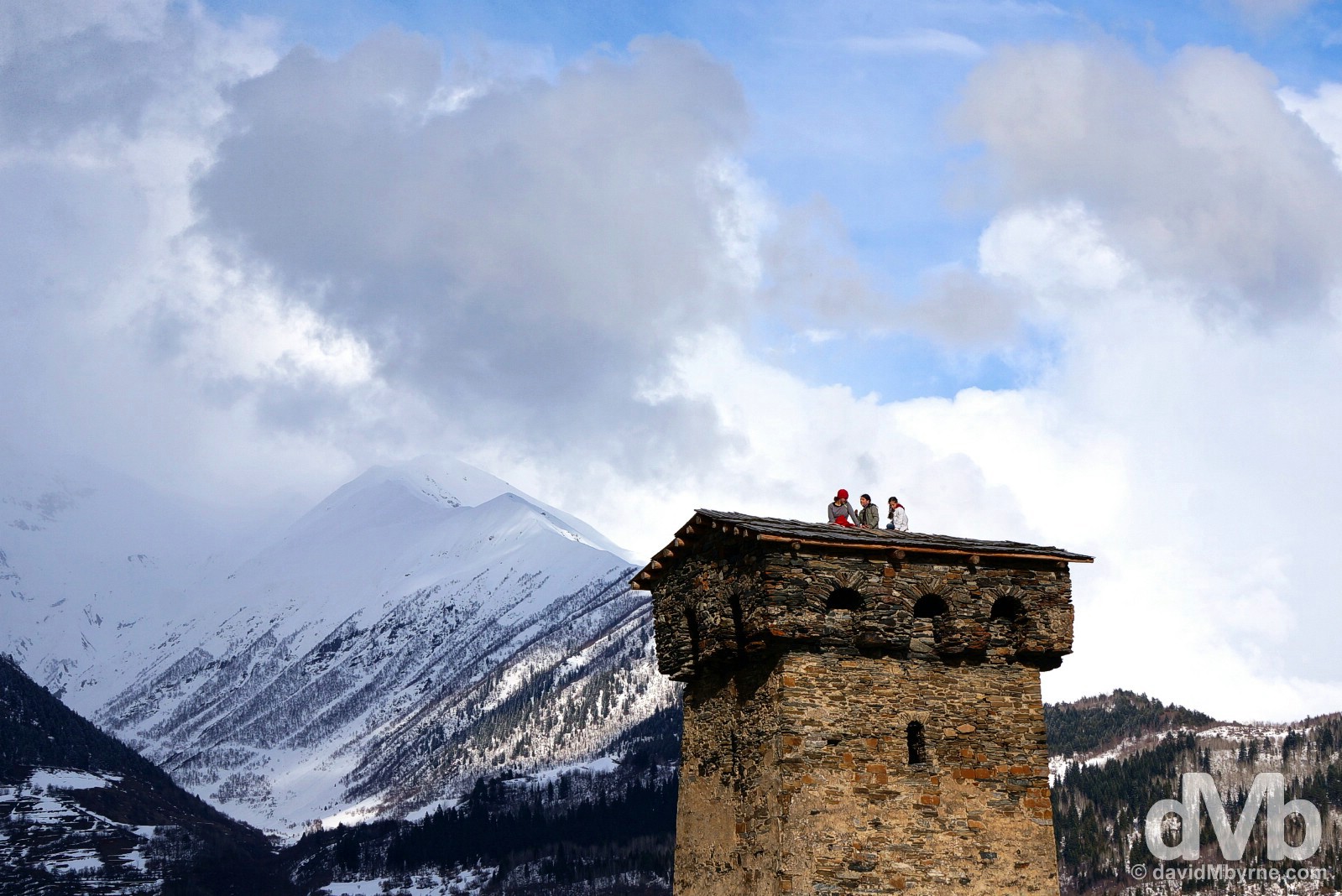 Sitting atop one of the distinctive Svan Towers in the highland town of Mestia in the Caucasus Mountains in northwest Georgia. March 21, 2015. 