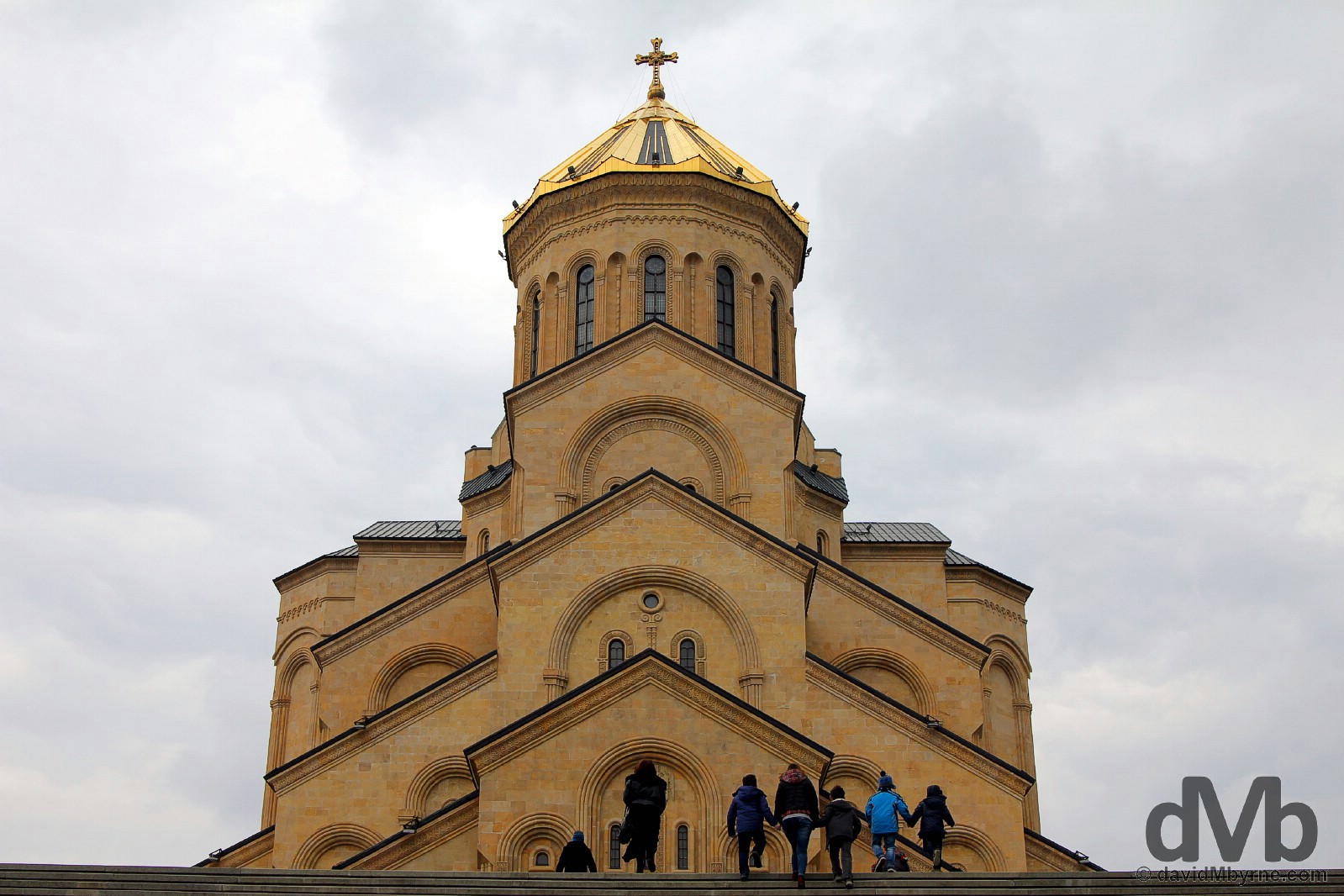 Climbing the steps fronting the massive Tsminda Sameba Cathedral in Tbilisi, Georgia. March 19, 2015.
