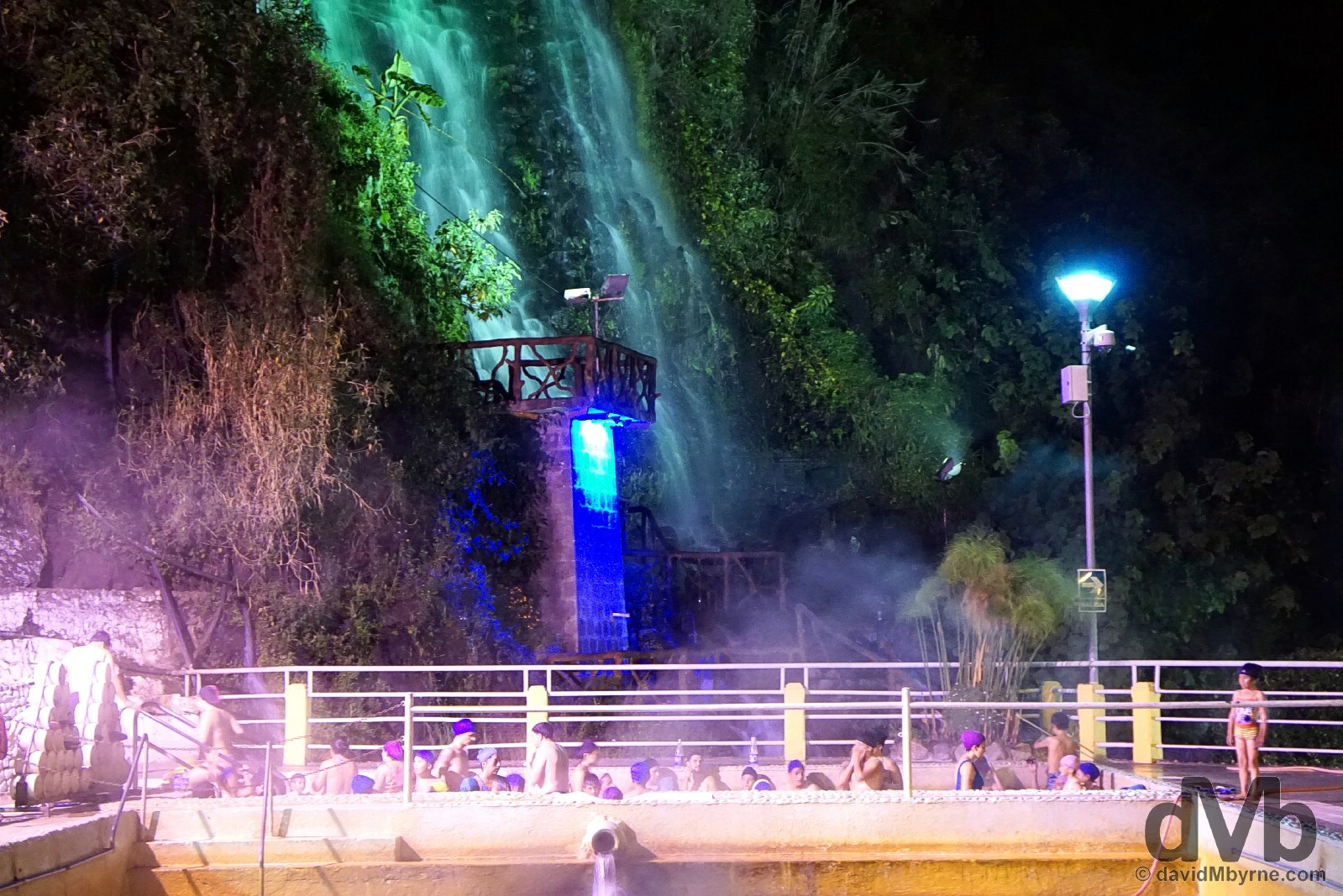 Night bathing at the Piscinas de la Virgen near the base of the Virgen waterfall in Banos, Ecuador. July 9, 2015.
