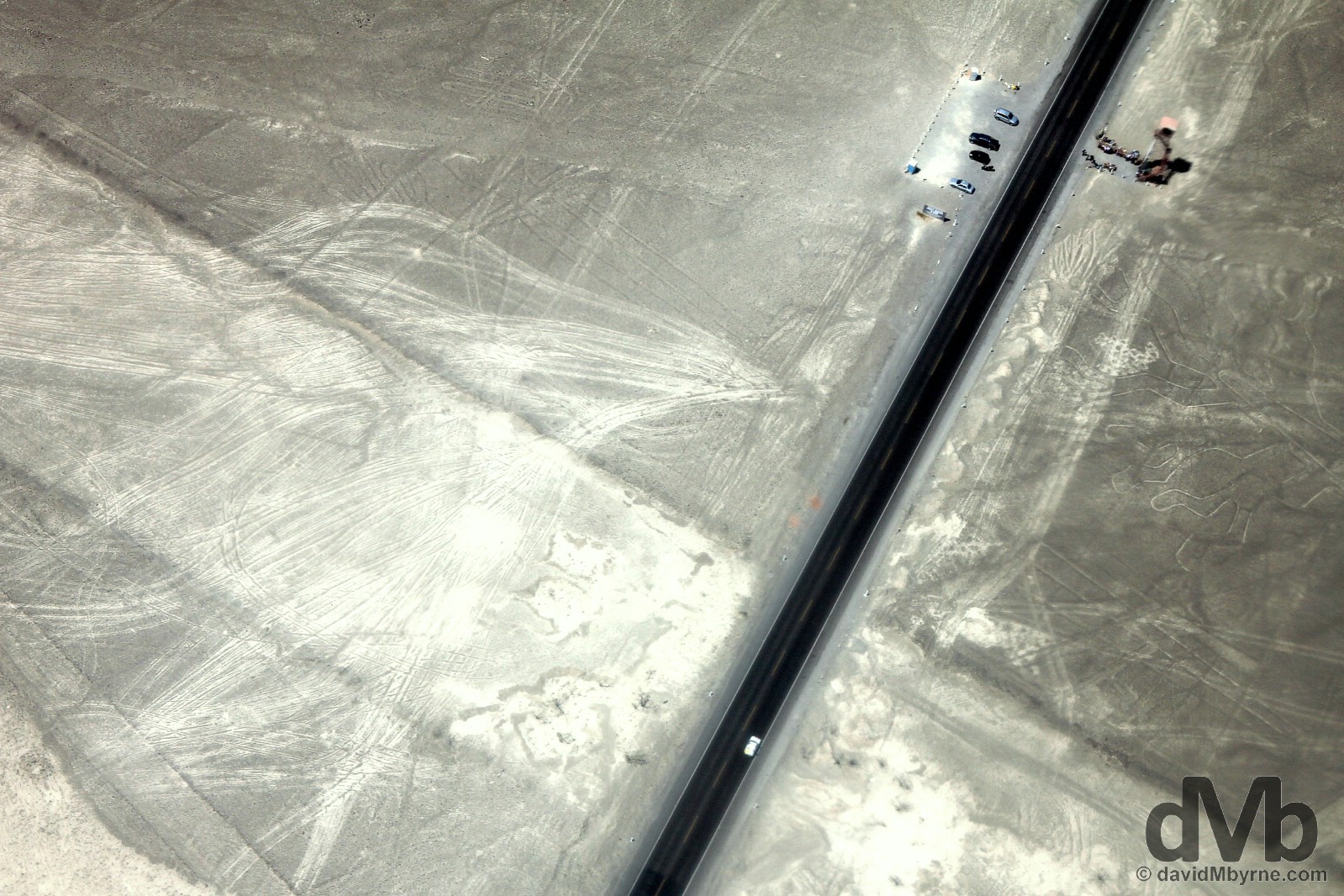 The viewing tower of the Nasca Lines and a section of the Pan-American Highway through the Nasca Plain as seen from on high. Nasca Plain, southern Peru. August 11, 2015. 