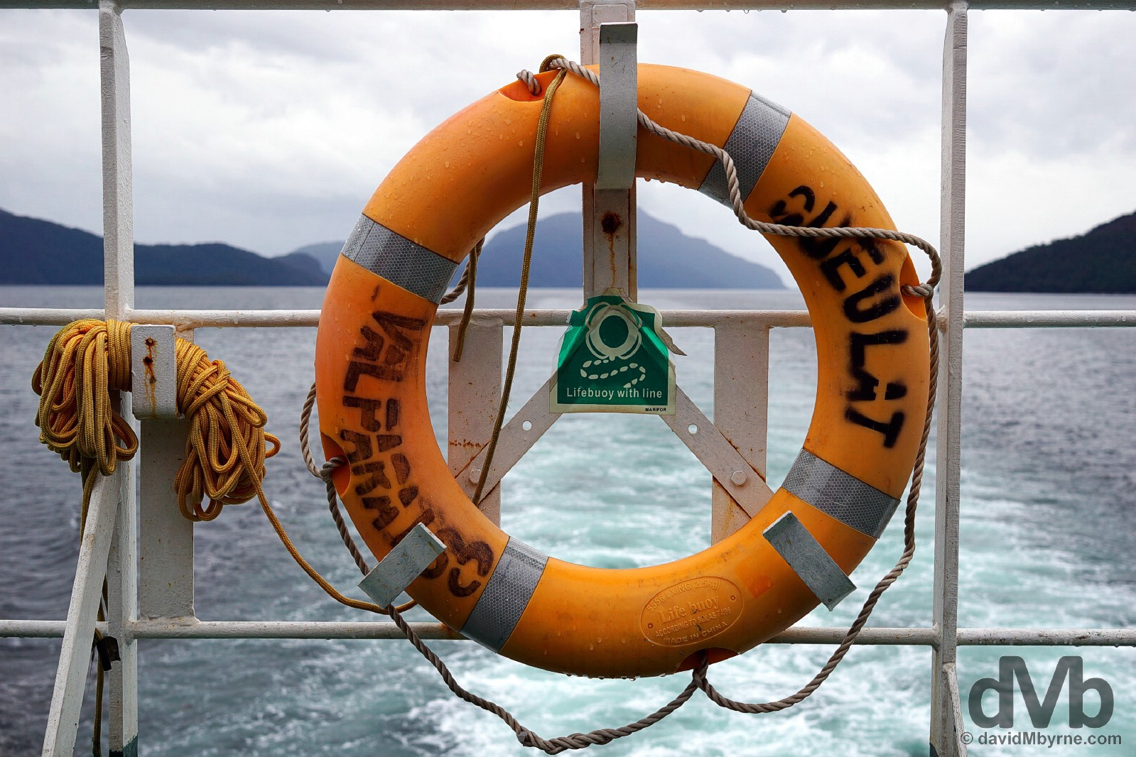 A life ring of the Valparaiso registered Queulat (slowly) plying the Canal Moraleda en route from Quellon, Chiloe, to Puerto Chacabuco, Chile. October 25, 2015.  
