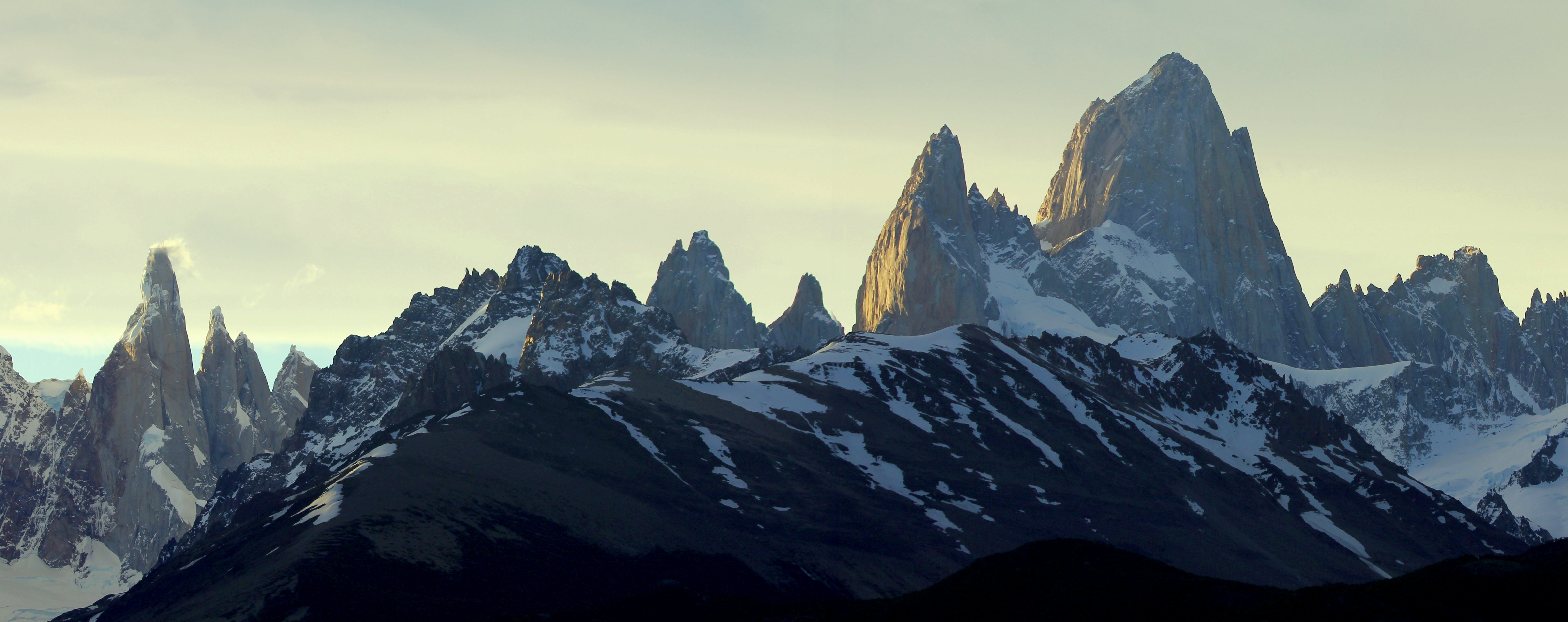 A panorama showing the last rays of the day striking the distinctive peaks of the Fitz Roy sector of Parque Nacional Los Glaciares in southern Patagonia, Argentina. November 3, 2015.