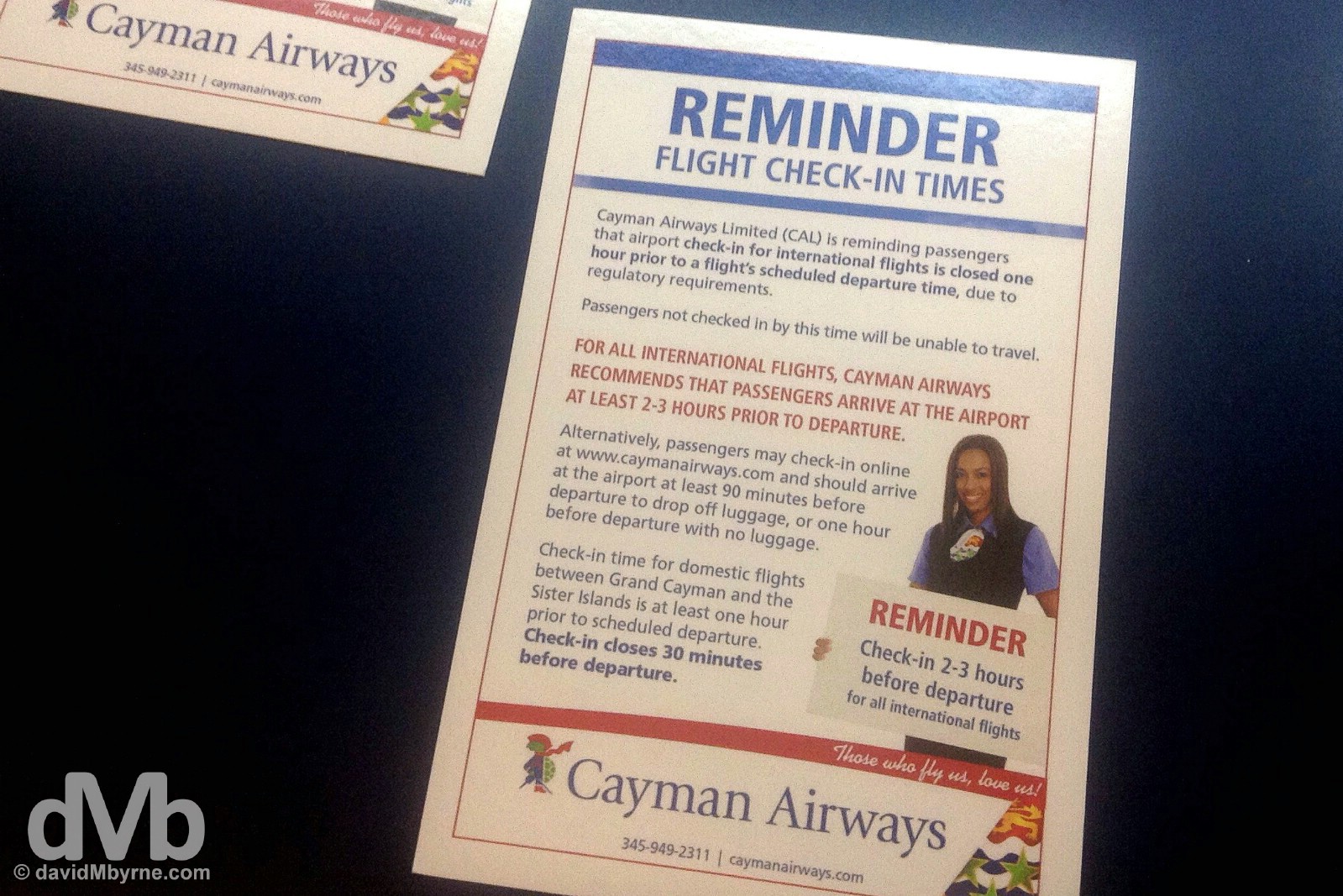 Cayman Airways Check-in reminder. Owen Roberts International Airport, Grand Cayman, Cayman Islands, Greater Antilles. May 12, 2015. 