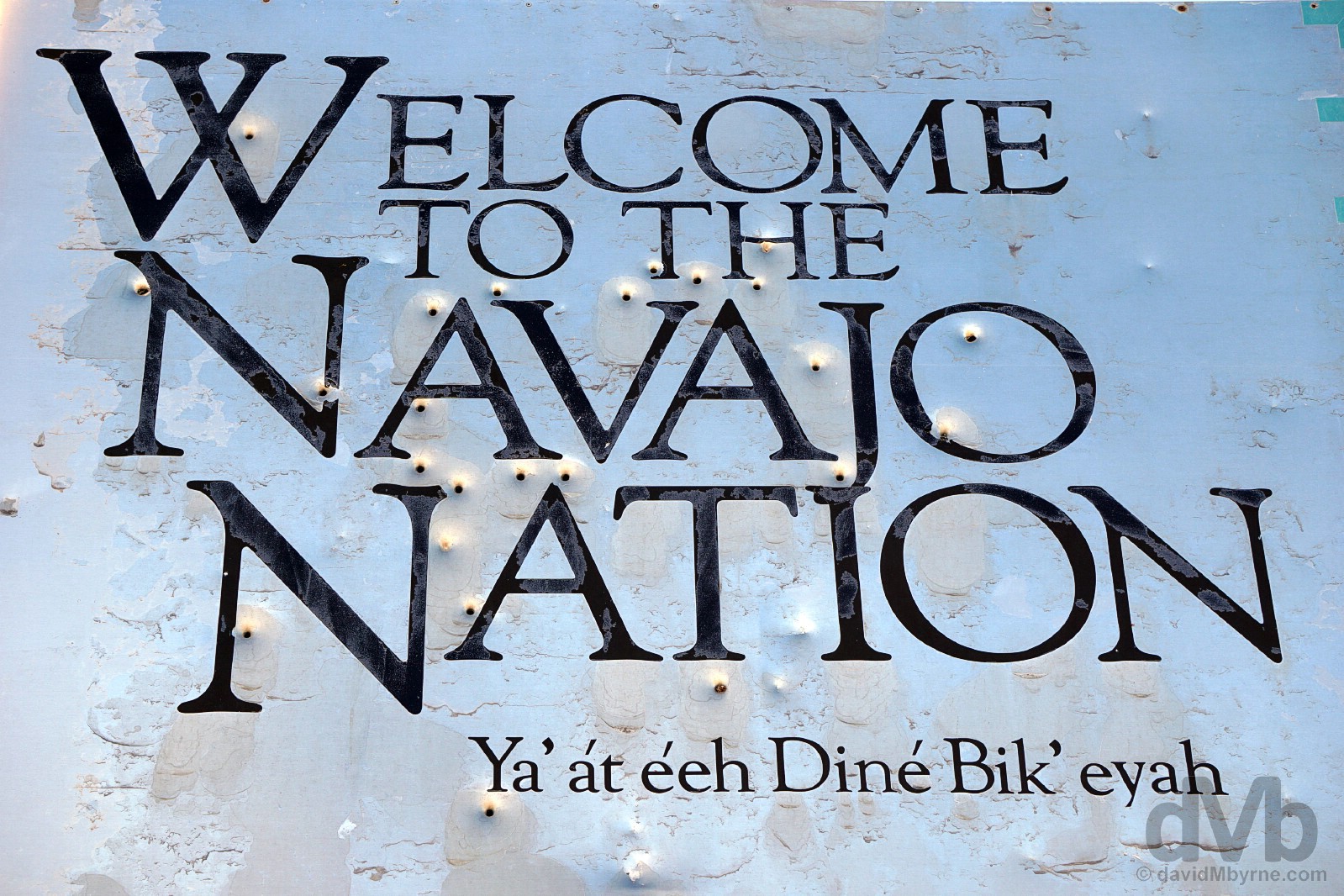 A bullet hole-infused 'Welcome To The Navajo Nation' sign near the Four Corners Monument off US 160 on the New Mexico/Arizona state line. September 10, 2016,