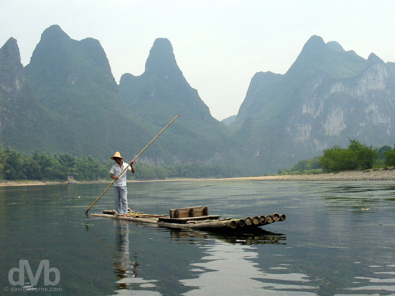 Navigating the scenic Li River outside Yangshou in Guangxi Province, Southern China. September 13, 2004.